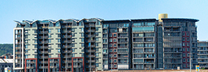 This image has an empty alt attribute; its file name is Apartment-Building-Stock-Photo.jpg